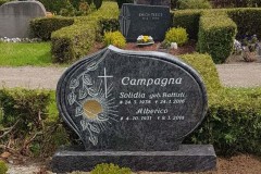 Benninghausen, Grabstein mit Sonnenornament und Kreuz